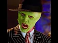 A man puts on a green mask and transforms into a superpowered hero