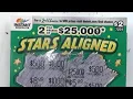 Scratching an Instant Scratch Off Lottery Ticket called Stars Aligned - Australian Lotteries
