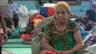 Nepal flood survivors share grief at temporary relief centre | AFP