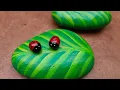 Lady bug on leaf stone painting Rock Painting Tutorial For Beginners Ladybug