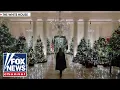 'HOME IS WHERE THE HEART IS': Melania Trump decorates the White House for Christmas