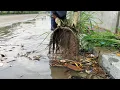 Lagu Street Flooding Rescue Clearing Trash from a Culvert During Heavy Rain