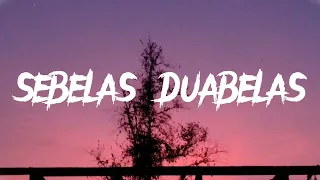 Download lirik sebelas duabelas MP3