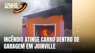 Carro pega fogo em garagem de residência em Joinville