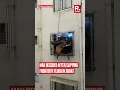 Lagu Chilling Visuals Show Man Hanging from Building Grill