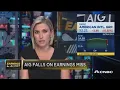 AIG down on earnings miss