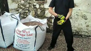Shovelling stone from a bulk bag Cut the bag