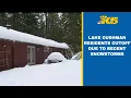 Snow downed trees trap residents in Lake Cushman neighborhoods