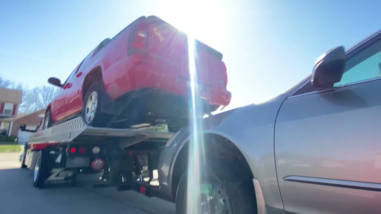 Loading a car on rollback manual wheel lift and using lasso straps