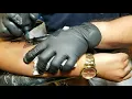 Rose tattoo on left forearm