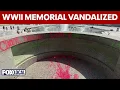 WWII Memorial vandalized shows woman spray-painting monument on National Mall