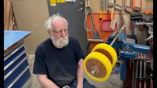 The stops on the axis keeps the wheels in place.