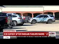 9 in custody after massage parlors raided