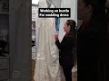 Lagu Working on a bustle for a wedding dress