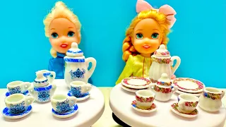 Elsa and Anna toddlers have a tea party with friends