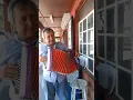 Cantando afuera de Vera s meat market Alex