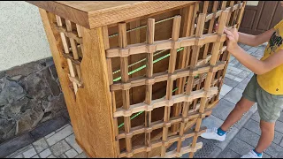 A cabinet made of red oak with lattice walnut doors