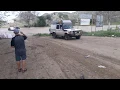 LANDCRUISER PULLING TRUCK OUT OF RIVER