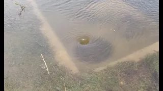 MASSIVE parking lot storm drain unclogging draining flooded parking lot with big whirlpool