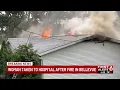 Woman taken to hospital after fire in Bellevue
