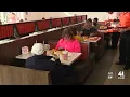 Customers brave long lines for the grand opening of Whataburger