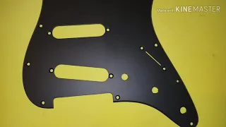 Chang the color of the pick guard guitar with spray paint
