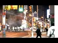 shows fireworks being lit on busy street in Toronto