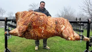 roasting a huge bull on a steel spit the best meat ive tasted