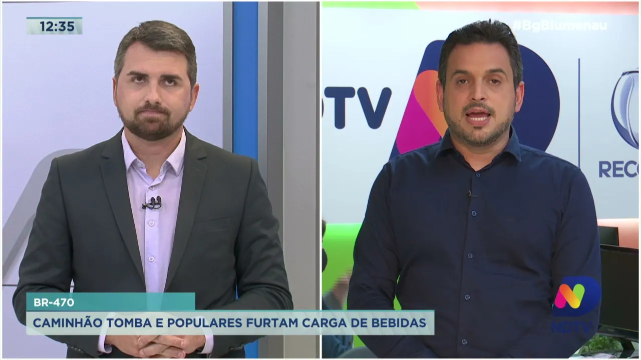 Caminhão tomba e populares furtam carga de bebidas na BR 470