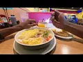 EGGS UP GRILL POV SHRIMP AND GRITS BOWL WITH A CLASSIC MIMOSA AND TOAST ON THE SIDE