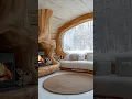Download Lagu Cozy cabin with flowing wood design, snowy views, and a warm, inviting fireplace.