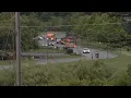 Man dead woman rescued after car goes airborne into retention pond