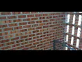Perforated brick wall that allows natural ventilation for staircase