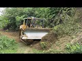 Lagu D6R XL Bulldozer Working to Widen the Road Body in the Mountain Plantation