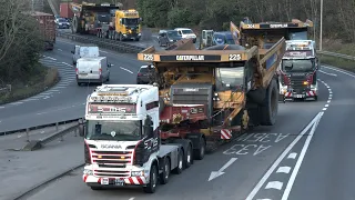 large dump trucks transported as convoy take over road 