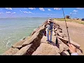 Fishing the Texas City Dike in August for a limit of Speckled Trout