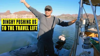 Broken diesel engine.  Forced to hip tie the dinghy to push us into the travel lift.
