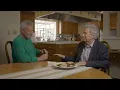 Alex Trebek serves Regis Philbin a Sandwich