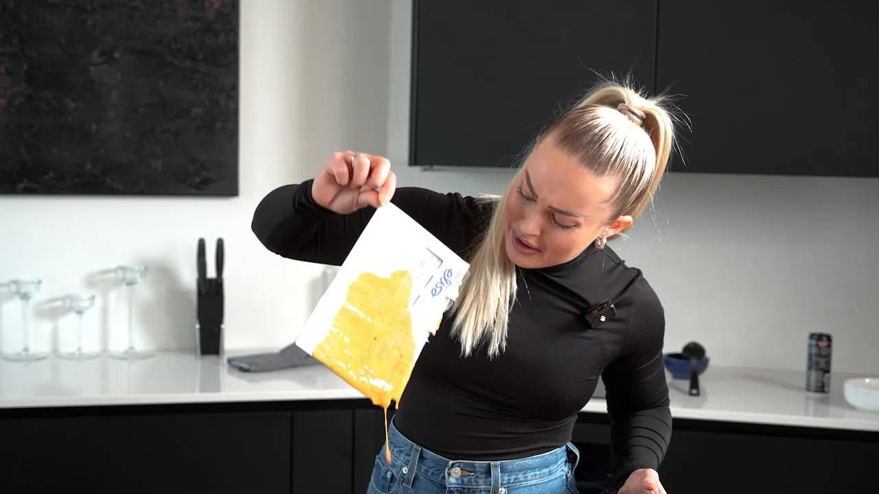 The video opens with a close-up of a woman smiling and holding a pot of soup, with a timer overlay. The scene then shifts…