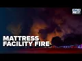Officials Battle Reignited Fire at Mattress Production Facility