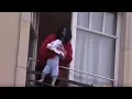 Lagu Michael Jackson dangles his baby over a hotel balcony