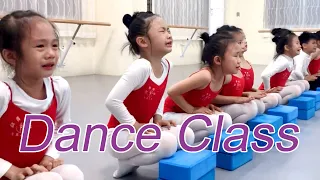 Download The little Chinese girl works hard at dancing in class, wetting her clothes with sweat. MP3