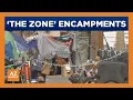 Encampments go back up in The Zone