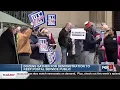 Dozens gather to protest a proposal to keep the postal service public