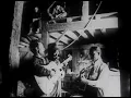 Woody Guthrie playing “John Henry” with Brownie McGhee and Sonny Terry in 1947.