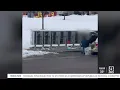shows US Postal Service carrier tossing packages near Missoula mailboxes