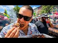 Eating Jerk Chicken at the Jamaican Rising Day Parade and Cultural Festival Brooklyn NYC