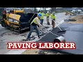 Asphalt Paving Laborers In Action