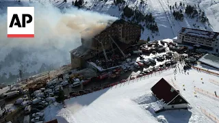 Witnesses at a Turkish ski resort stood helpless as people leaped out of a burning hotel