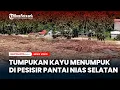 Tumpukan Kayu Menumpuk di Pesisir Pantai Nias Selatan
